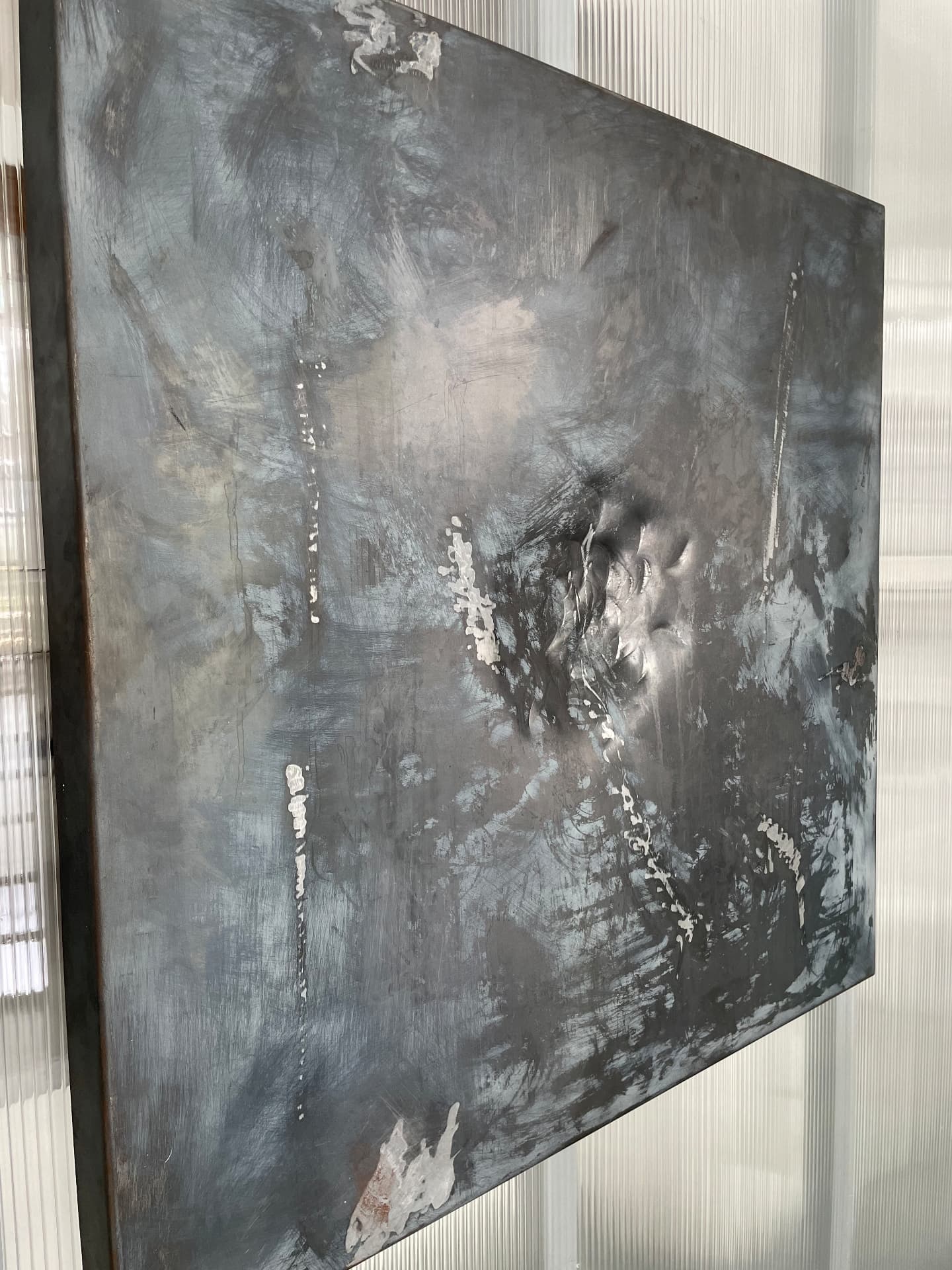 Maelstrom detail showing gestural silver marks on dark steel