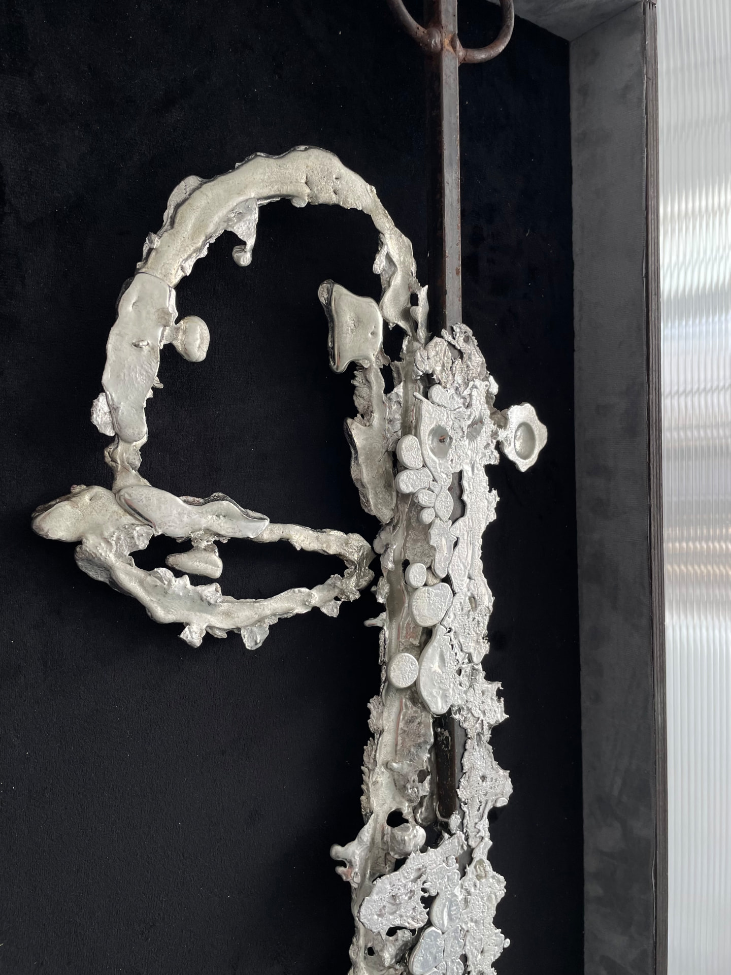 Close-up of the cast form on black velvet