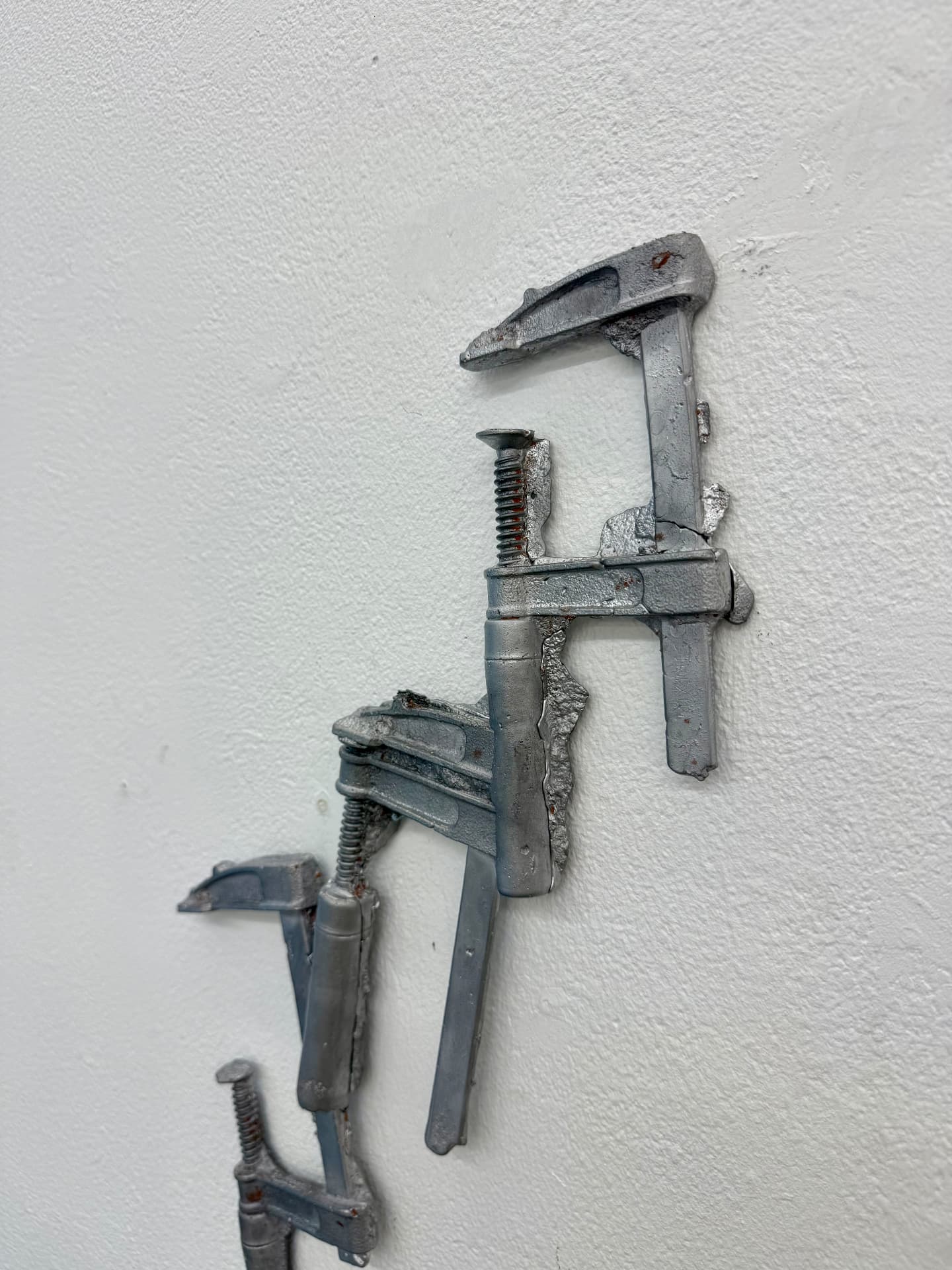 Close-up of stacked steel clamp forms