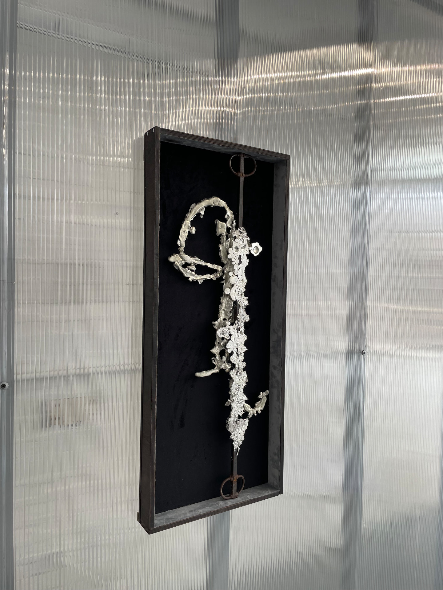 Undertow installed against ribbed translucent wall